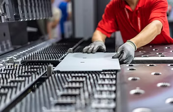Operator working with manufacturing equipment